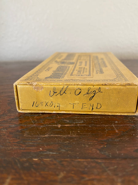 Antique Advertising box for Blackshield Mainsprings, up close of writing on side of box.