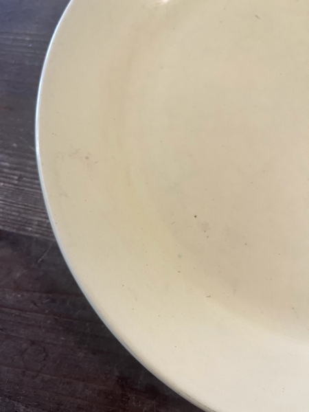 Vintage Bauer pottery plate has some stains on the front
