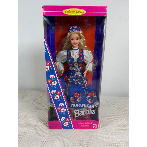 A boxed Barbie doll from the Norwegian collection, shown in its original retail packaging. The doll has blonde hair and is wearing a traditional Norwegian outfit with a blue vest, white blouse, and blue skirt with red floral patterns. Norwegian Barbie Dolls Of The World Collection 1992 Special Edition 3626 NIB 