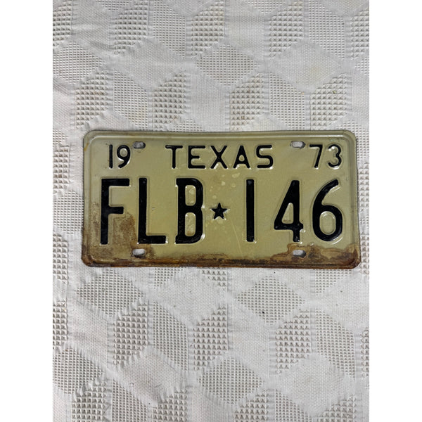 Vintage 1973 Texas License Plate FLB 146 Black Embossed Lettering On White Metal