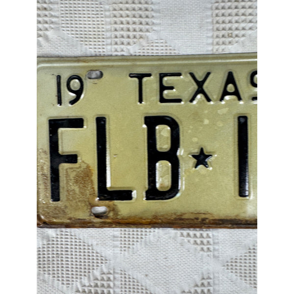 Vintage 1973 Texas License Plate FLB 146 Black Embossed Lettering On White Metal