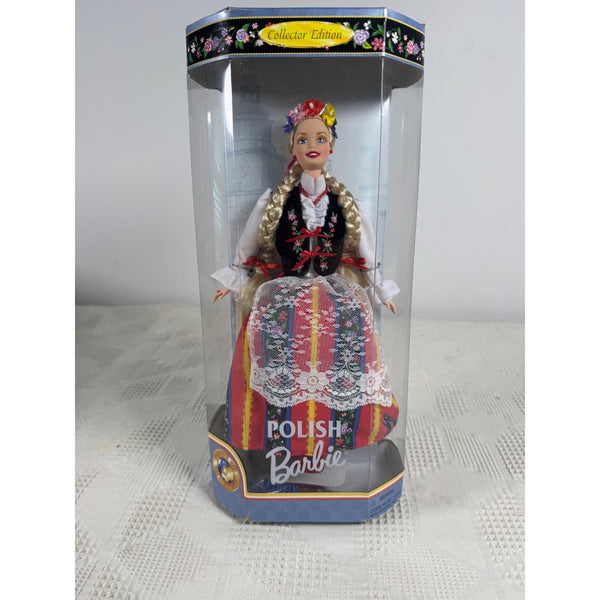 A collectible Polish Barbie doll in traditional Polish folk dress, displayed inside its original clear plastic packaging box. The doll features blonde braided hair, a colorful floral headpiece, and a detailed multicolor costume with red, blue, yellow, and white patterns. Polish Barbie Collector Edition Dolls Of The World 1997 Mattel 18560 NIB