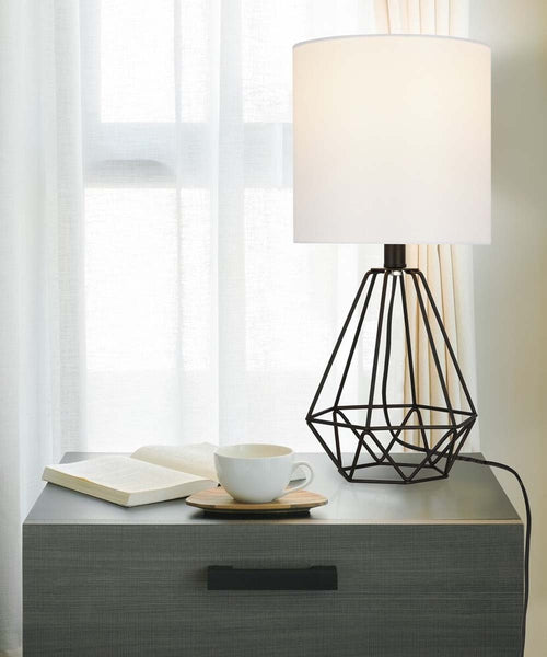 Catalina 18"H Metal Geometric Cage Matte Black Finish Table Lamp with White Linen Drum Shade on night stand