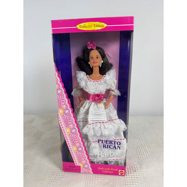 A boxed Barbie doll labeled 'Puerto Rican' and 'Collector Edition,' shown in its retail packaging on a light surface against a plain light gray background. Puerto Rican Barbie Dolls Of The World Collection 1996 Special Ed 16754 NIB 