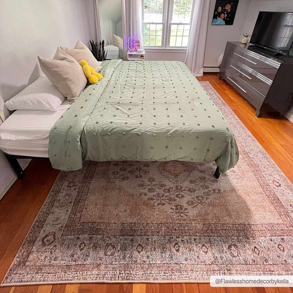 Analu Peach Washable Area Rug in bedroom