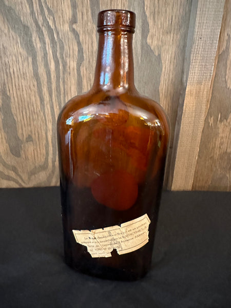 Antique Dom Benedictine Amber Bottle back view