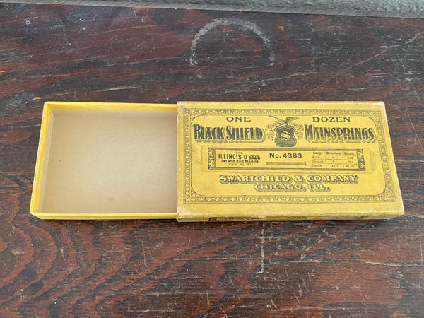 Antique Advertising box for Blackshield Mainsprings, top view with box empty.