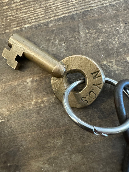 Antique NYCS Railroad Padlock and Key closeup on key