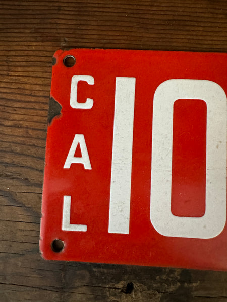 Antique 1914 CA State Red License Plate left side closeup