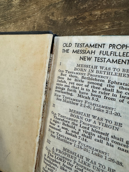 Mini New Testament Old Testament Prophecy Edition Bible pulling away from spine