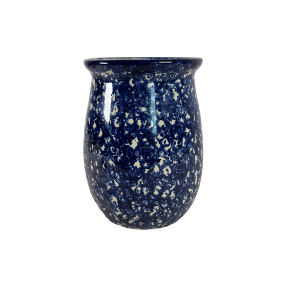 Handcrafted Blue Spongeware Ceramic Vase Signed By Artist Rodrigo Marshall TX. A small ceramic jar or vase with a rounded body and flared rim, covered in a glossy dark blue glaze with dense white speckling, set on a white textured cloth against a light gray background.