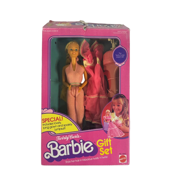 Twirly Curls Barbie Gift Set 1982 Mattel No 4097 w 2 Outfits and Accessories . Vintage Barbie Gift Set in its original pink packaging, featuring a blonde doll in a pink dress and a doll in a peach outfit, displayed on a textured white fabric background.