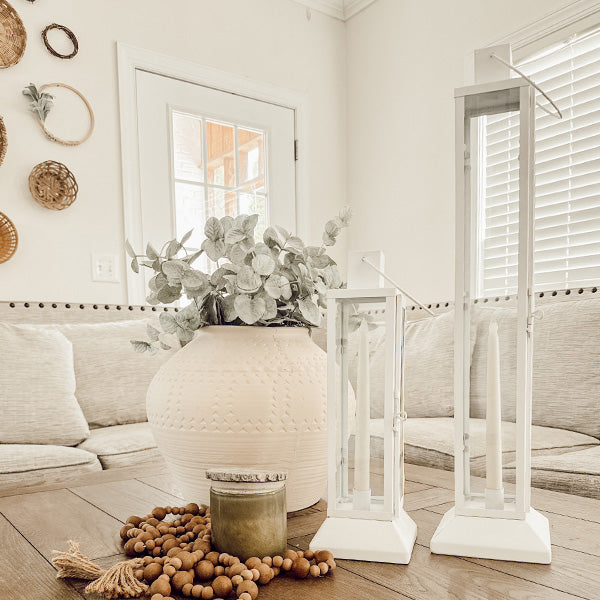 Tall Farmhouse White Metal Lanterns displayed in living room