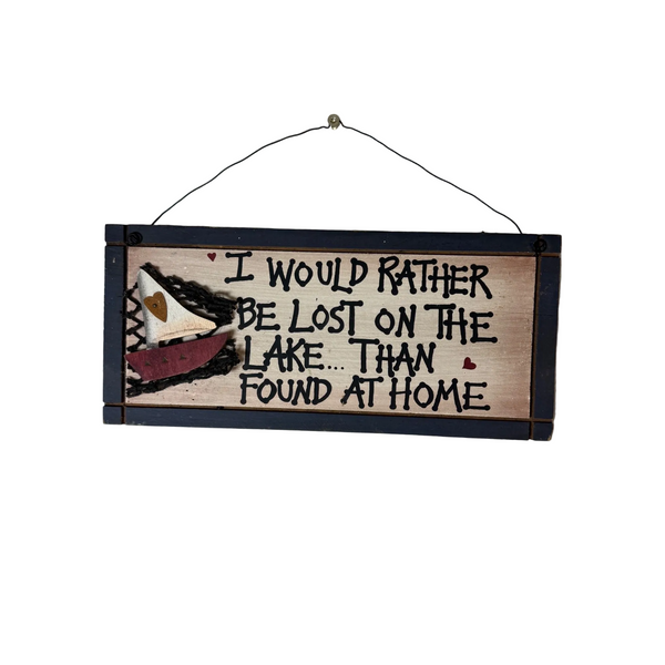 Handmade Wooden Sign I Would Rather Be Lost On The Lake Than Found At Home . A rustic wooden hanging sign with a black painted border, hand-painted text reading 'I WOULD RATHER BE LOST ON THE LAKE.