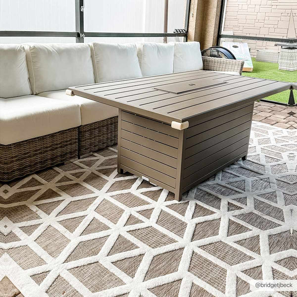 Nuri Tan Outdoor Rug staged with furniture