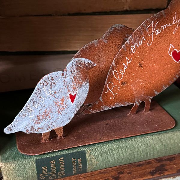 Rustic Steel Mother Quail and Family displayed on bookshelf