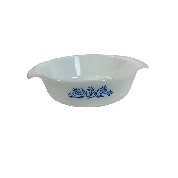 Anchor Hocking Fire King One Quart White Casserole Dish Blue Cornflower Design. A white glass baking dish with blue floral patterns, resting on a textured white tablecloth.