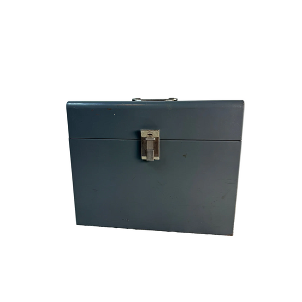 Vintage Gray Metal File Box With Handle And Latch Mid Century c1960s Storage. A dark gray metal storage box with a silver latch and handle, sitting on a textured white surface against a light gray background.