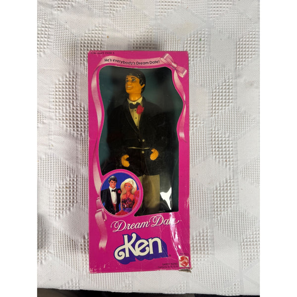 Vintage Dream Daddy Ken doll in its original pink packaging, displayed on a textured white fabric background. Dream Date Ken Doll in Tuxedo By Mattel 1982 Vintage Collectible 4077 NIB