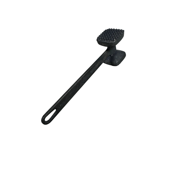 Vintage Aluminum Meat Tenderizer With Two Sided Hammer For Meat Preparation. A black cast iron butchory knife with a textured, spiked head and a long handle with a hanging loop, resting on a textured white quilted blanket.