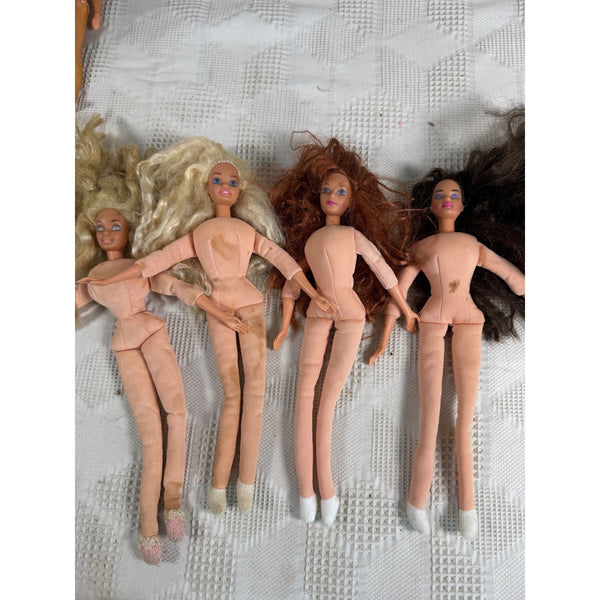 Vintage Lot Of 4 Mattel Bed Time Barbie Dolls With Soft Fabric Bodies 1990s. Four vintage Barbie-style dolls with pale peach skin and white shoes, lying side by side on a textured white blanket. The dolls have blonde, light brown, auburn, and dark brown hair.