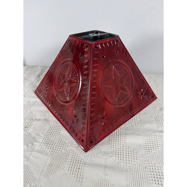 Punched Tin Star Design Red Lamp Light Shade Farmhouse Rustic Tin Pie Safe Style. A vintage red glass lantern shade with embossed western star and compass designs, displayed on a white textured fabric surface.