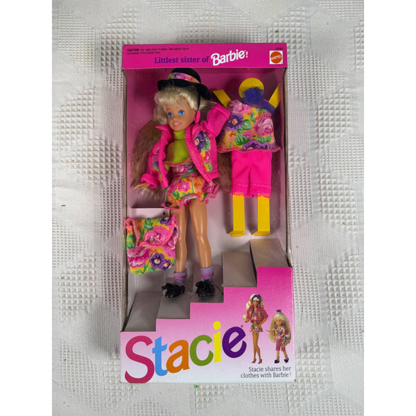 Vintage Stacie doll in its original pink packaging, featuring a blonde doll with colorful floral clothing and accessories, set against a textured white background. Stacie Doll Littlest Sister Of Barbie Vintage 1991 Mattel Floral Outfit 4240 NIB