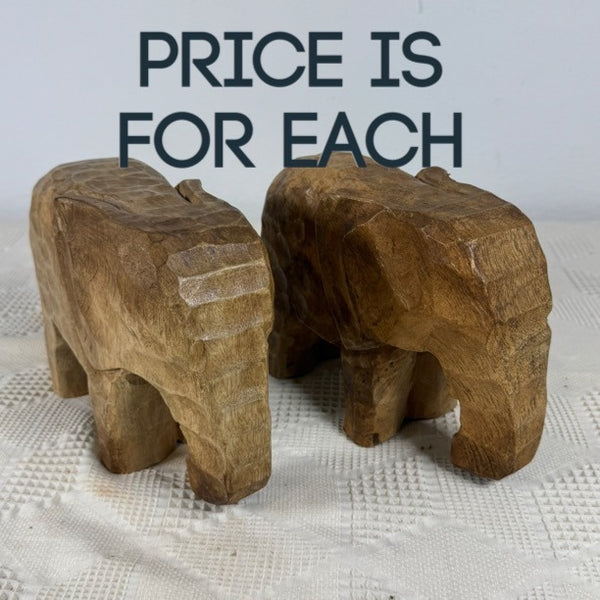 Hand Carved Wooden Elephant Figurine Rustic Animal Safari Global Decor . Two small hand-carved wooden elephant figurines on a textured white cloth, with the text 'PRICE IS FOR EACH' overlaid at the top.