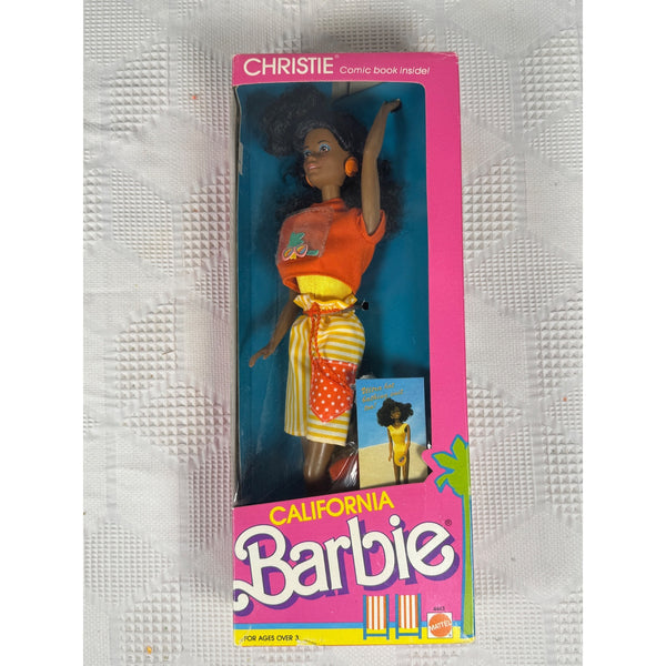 California Christie Barbie Doll Mattel Vintage 1987 Retro Tropical 4443 NIB. Vintage Christie Barbie comic book doll in its original pink and blue packaging, displayed on a textured white fabric background.