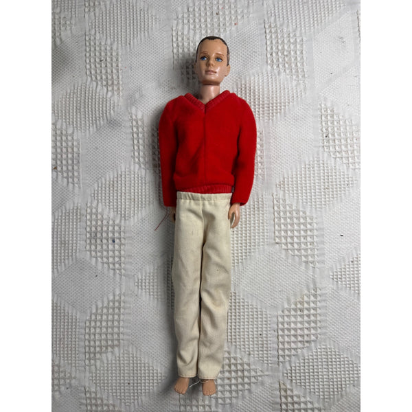 Original Ken MCMLX Barbies Boyfriend Vintage Doll Mattel 1960 Red Sweater Japan. A vintage male doll with short brown hair, wearing a bright red knit sweater and cream-colored trousers, standing against a textured white background.