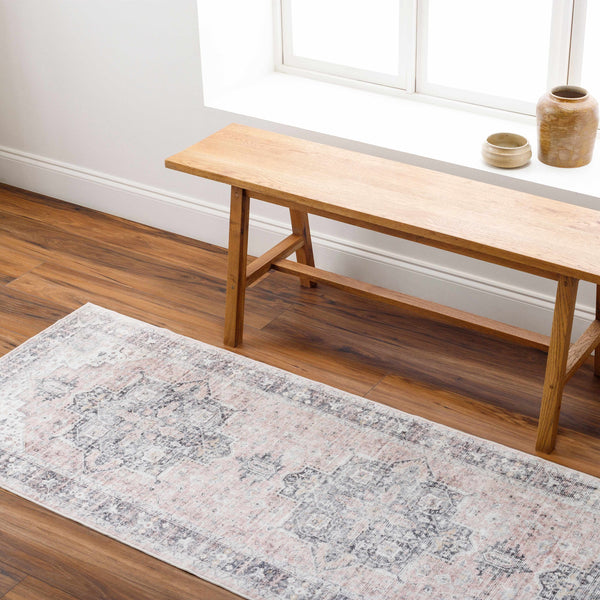 Luca Washable Area Rug staged with bench