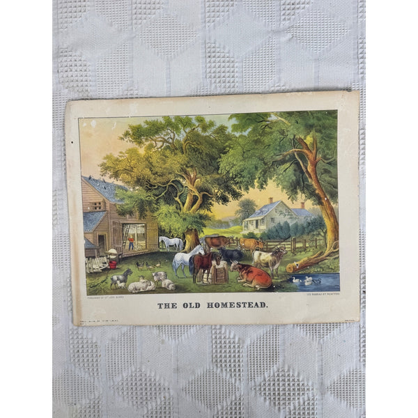 The Old Homestead Lithograph By Currier and Ives Farm Scene Made In USA Vintage. A vintage printed illustration titled "THE OLD HOMESTEAD" showing a rural farm scene with a farmhouse, trees, animals, and a small pond, photographed on a white textured fabric background.