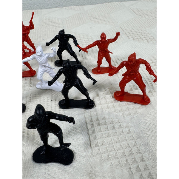 Vintage Plastic Ninja Figurines Set Of 13 In Red Black and White Army Men Style