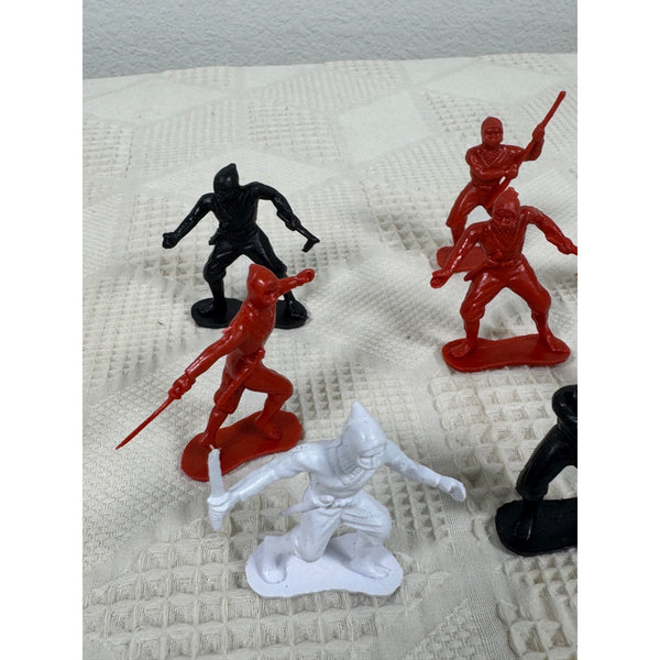 Vintage Plastic Ninja Figurines Set Of 13 In Red Black and White Army Men Style