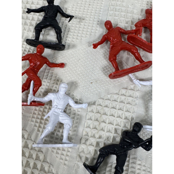 Vintage Plastic Ninja Figurines Set Of 13 In Red Black and White Army Men Style