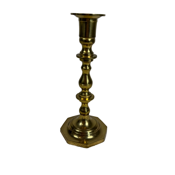 Vintage Brass Candlestick Taper Holder With Octagonal Base c1970s. A vintage brass candlestick holder with an octagonal base and a flared top, standing on a textured white surface against a light gray background.