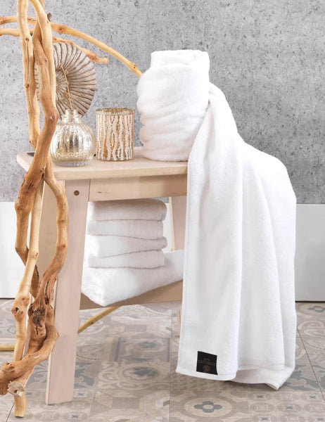 Sofya White Bath Towel displayed in bathroom