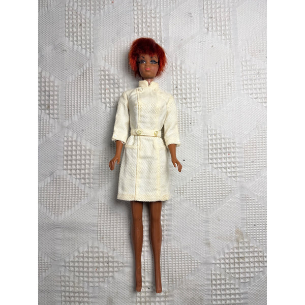 Vintage 1969 Julia Doll as Diahann Carroll w White Coat Red Hair TNT Bendable. A vintage fashion doll with red hair wearing a cream-colored textured jacket and skirt set, standing against a textured white background.