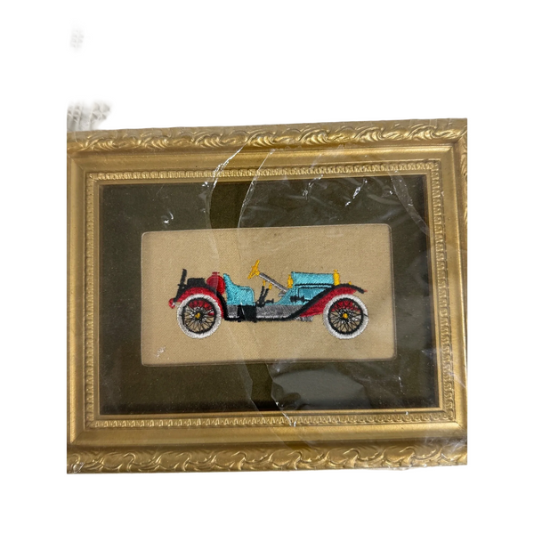 Hand Embroidered Vintage Car Art 1914 Stutz Bearcat Needle Painters Guild 1969. A small framed embroidered vintage car artwork on a beige fabric backing, enclosed in an ornate gold frame and photographed on a white textured textile background.