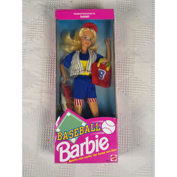 Vintage Barbie Baseball doll in its original pink window box packaging, featuring a blonde Barbie doll in a blue and white striped baseball uniform holding a red baseball bag.