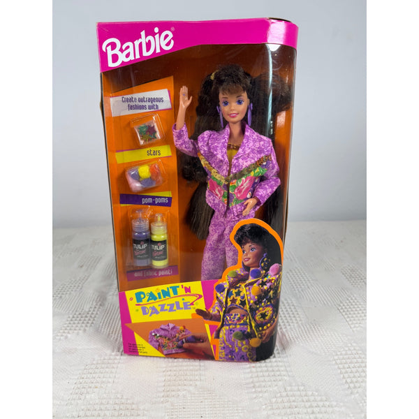 A vintage Barbie 'Pant 'n' Dazzle' doll in its original retail packaging, featuring a doll with long dark hair wearing a purple patterned jumpsuit with green and yellow accents. Barbie Paint N Dazzle Brunette Doll Vintage 1993 Mattel 10059 NIB