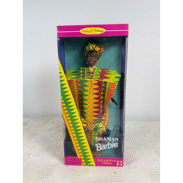 Ghanaian Barbie doll in its original packaging, featuring a colorful traditional patterned outfit and headwrap, with the text 'Ghanaian Barbie' and 'Doll of the World Collection' on the box. Ghanian Barbie Dolls Of The World Collection 1996 Special Edition 11299 NIB 
