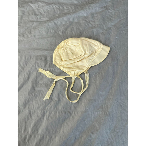 Baby yellow Bonnet with zig zag stitching