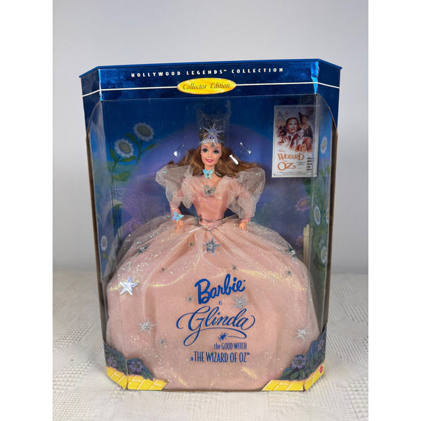 Barbie Glinda 'The Wizard of Oz' Hollywood Legends Collection card match box, featuring the doll in a pink ballgown through a clear plastic window on a light gray background. Barbie Hollywood Legends Glinda Good Witch Collector Edition Wizard Of Oz NIB