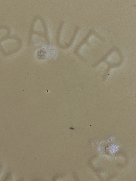 Vintage Bauer pottery plate has a few rough spots around the Bauer logo