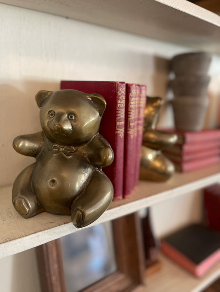 Vintage brass bear bookends staged