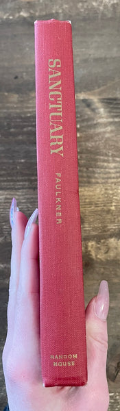 Sanctuary By William Faulkner spine, has some wear on the top and bottom