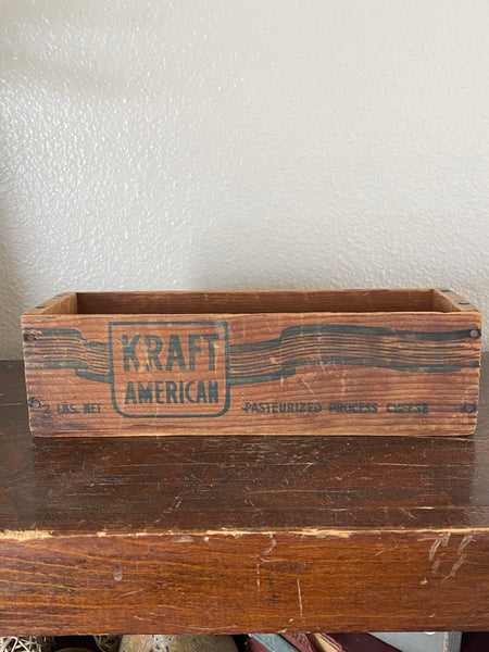 Antique Kraft wooden cheese box, darker graphic side view.