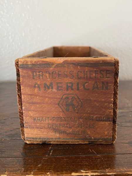 Antique Kraft wooden cheese box side view.