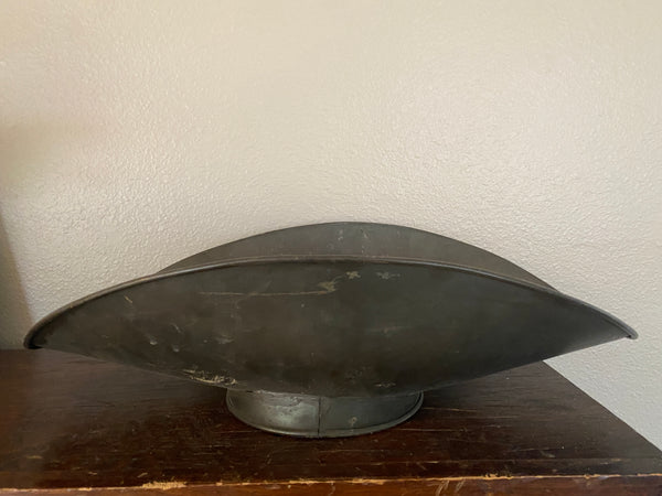 Antique scale pan, side view